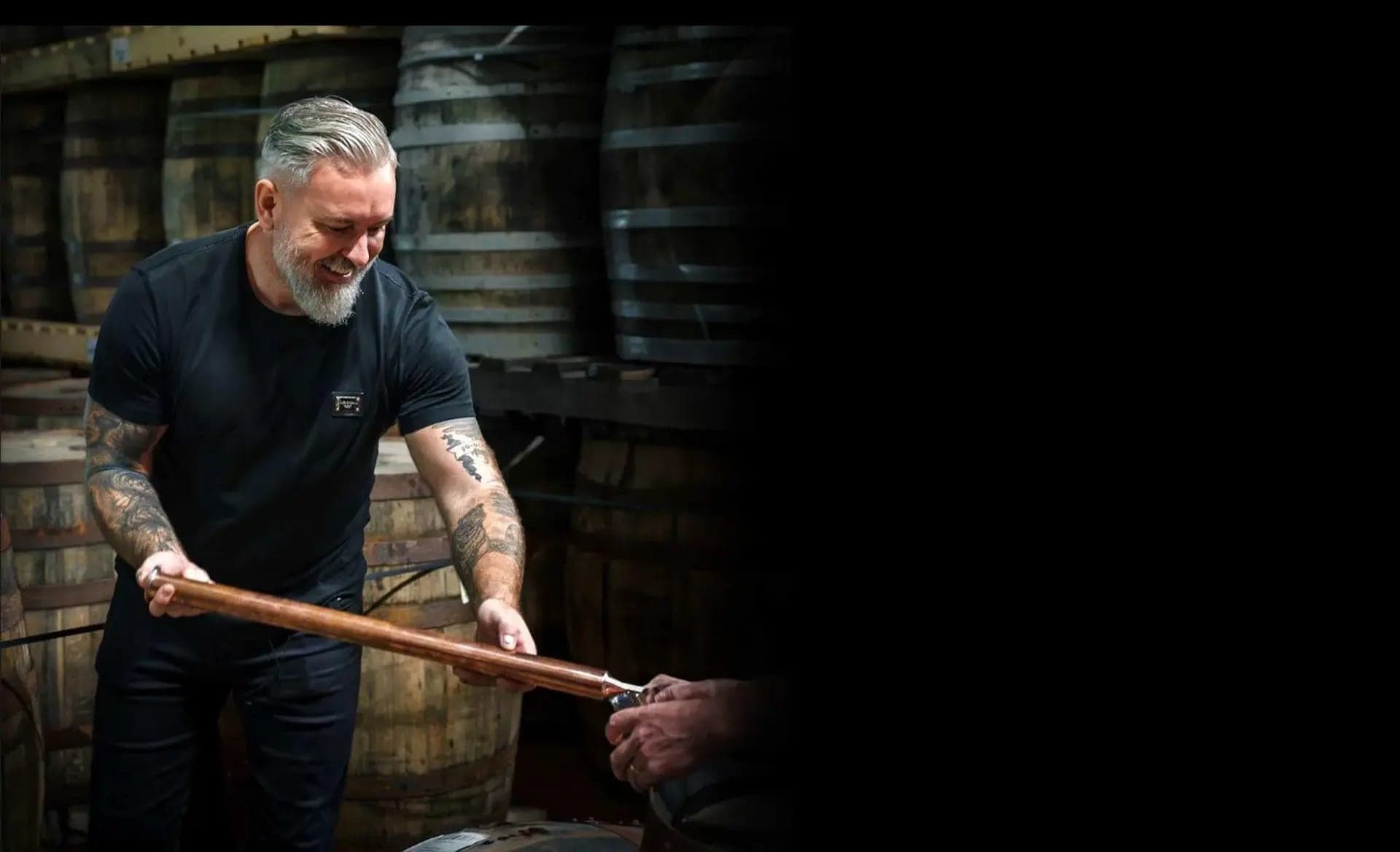 Jay Bradley drawing a sample from a maturing cask